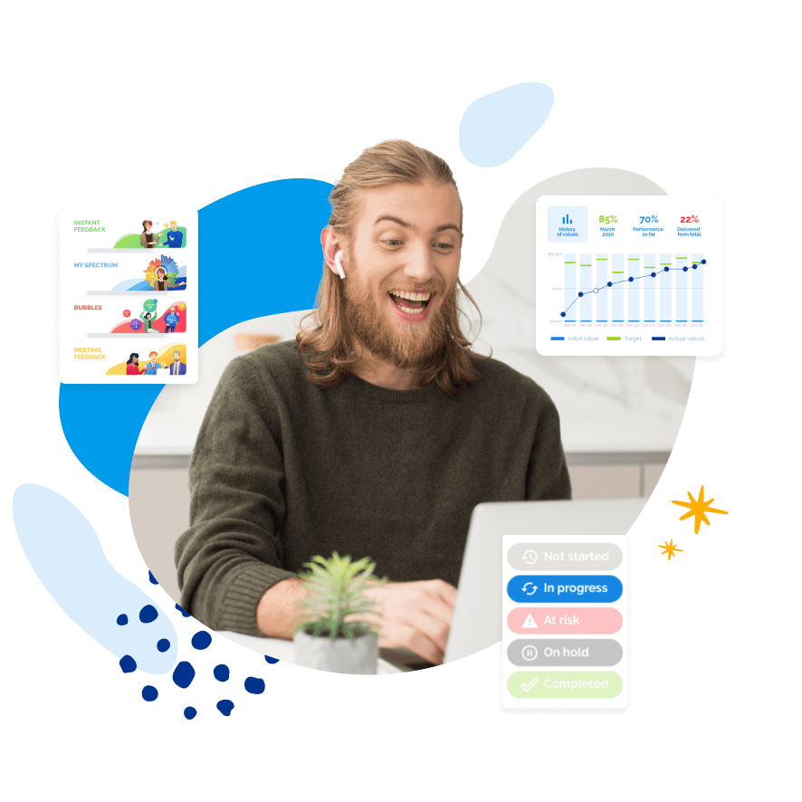 Enthusiastic man with a beard looking at a laptop, surrounded by data visualization charts.